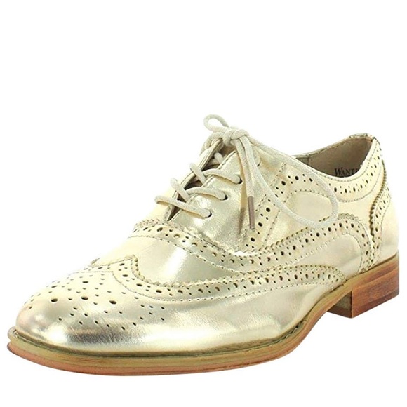 Gold wingtip Oxford shoe